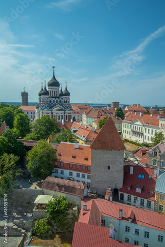 Aerial view of Tallinn Center, Estonia, with copy space during sunny summer day: Old town with outdoor bar terraces, Tall Herman with Estonian flag and Russian Orthodox church