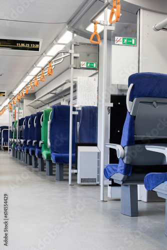Passenger seats in an empty train. Rows of unoccupied seats