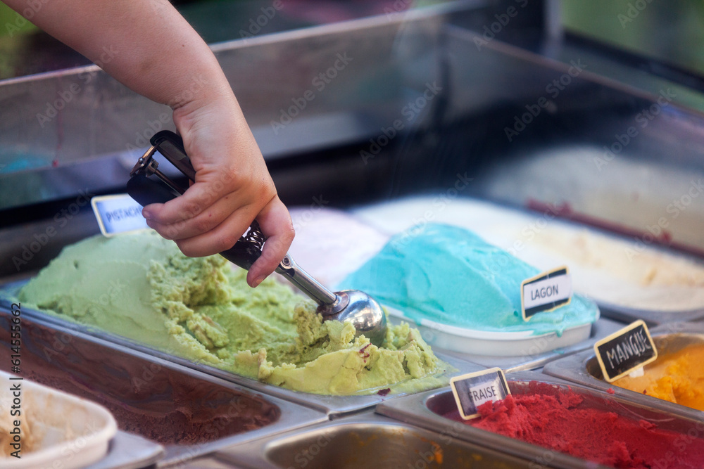 Woman scooping on ice cream