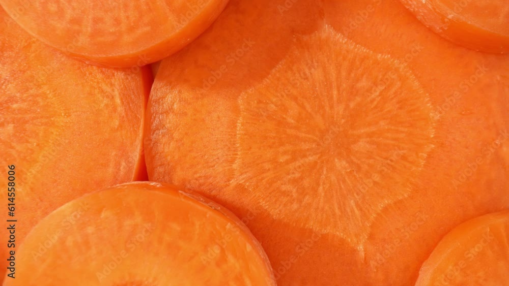 The camera delves into the texture of the carrot. It exposes the intricate network of fine lines and pores on the surface, unveiling the organic patterns that give the slice its unique character.
The camera delves into the texture of the carrot. It exposes the intricate network of fine lines and pores on the surface, unveiling the organic patterns that give the slice its unique character.