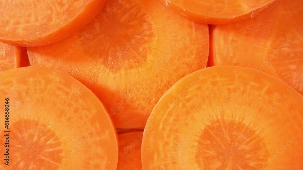 The camera zooms in on the carrot slice, the video reveals the vibrant orange color of the vegetable, with subtle variations and gradients that create a visually appealing composition. 4K HDR
The camera zooms in on the carrot slice, the video reveals the vibrant orange color of the vegetable, with subtle variations and gradients that create a visually appealing composition. 4K HDR
