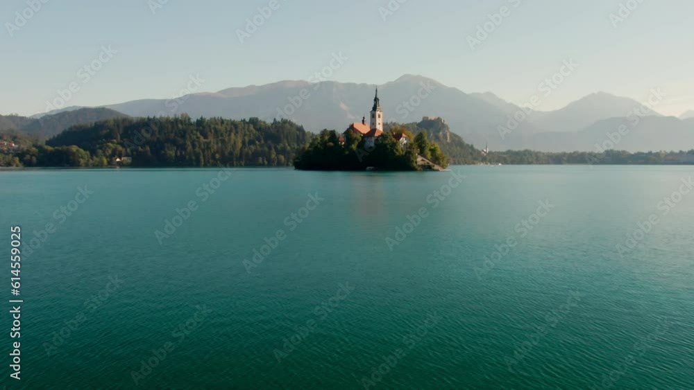Aerial view of Church of Assumption on Isle on Bled lake among Alps in Slovenia, Central Europe. Natural Landscape of Julian Alps. Travel and tourism concept. 4k orbit shot Aerial view of Church of Assumption on Isle on Bled lake among Alps in Slovenia, Central Europe. Natural Landscape of Julian Alps. Travel and tourism concept. 4k orbit shot