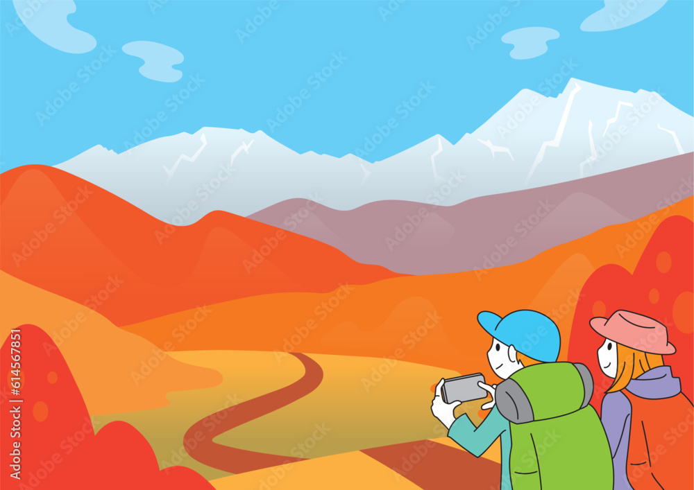 紅葉した山並みと若い男女の登山者　秋の風景