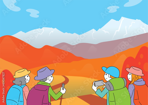 紅葉した山並みと4人の登山者　秋の風景
