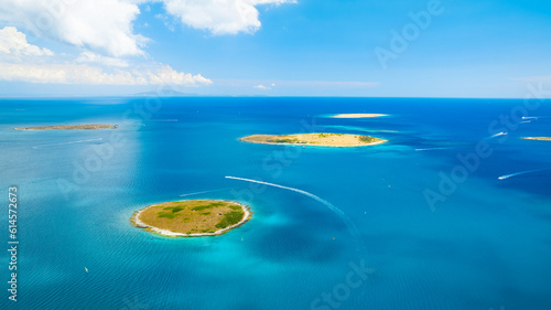 View from the air on the sea and islands. Sea relaxation and travel. Azure water on the sea. A bright sunny day during a summer vacation. View from a drone.