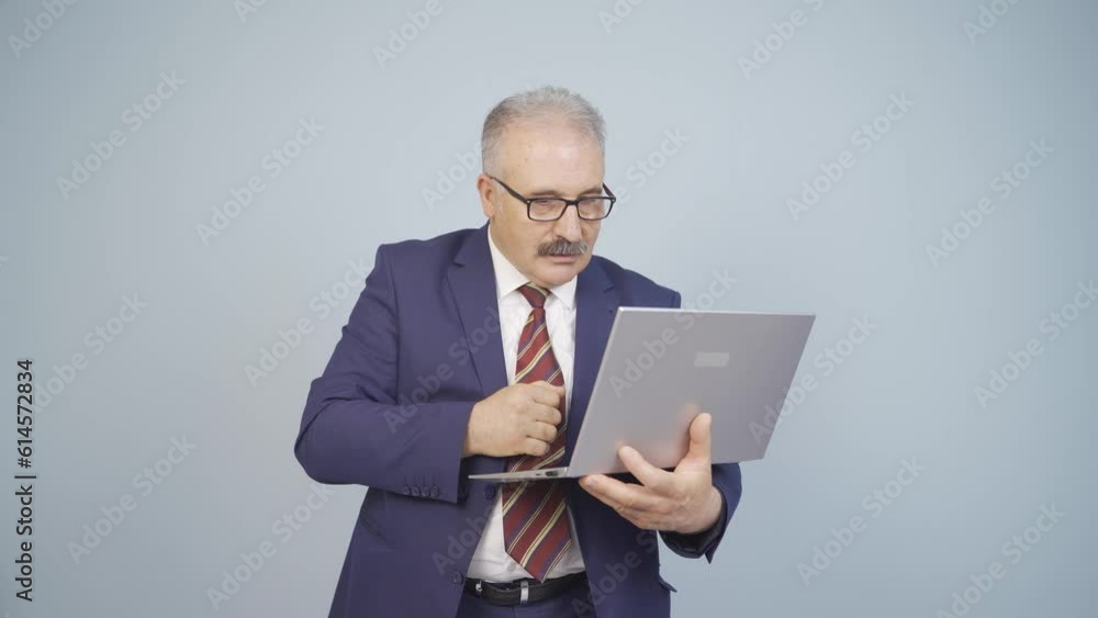 Businessman looking at laptop with excitement. Businessman looking at laptop with excitement.
