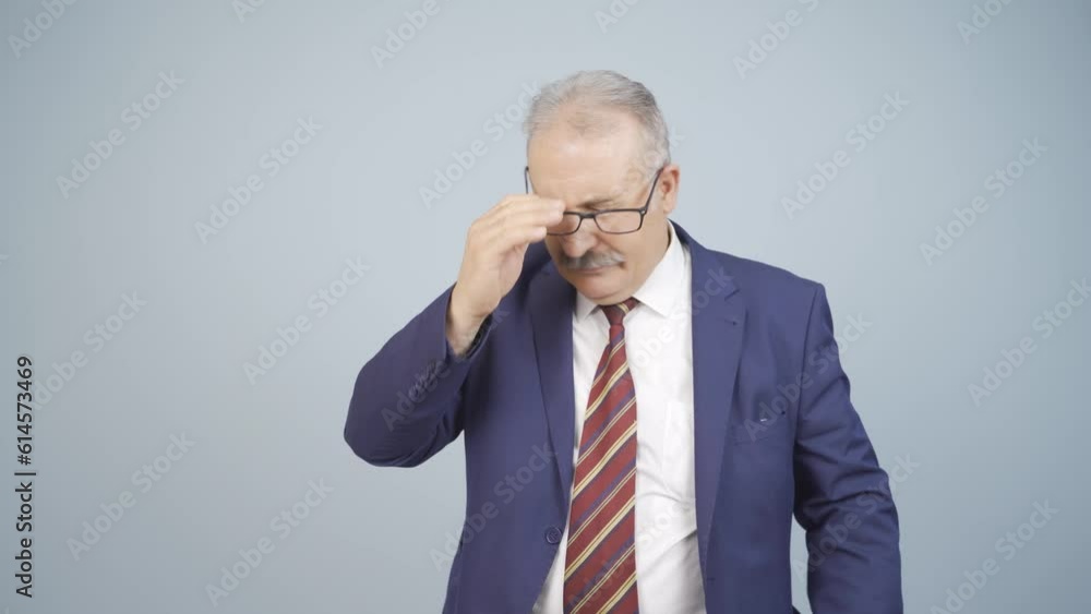 Bored businessman looking at camera unhappy. Bored businessman looking at camera unhappy.