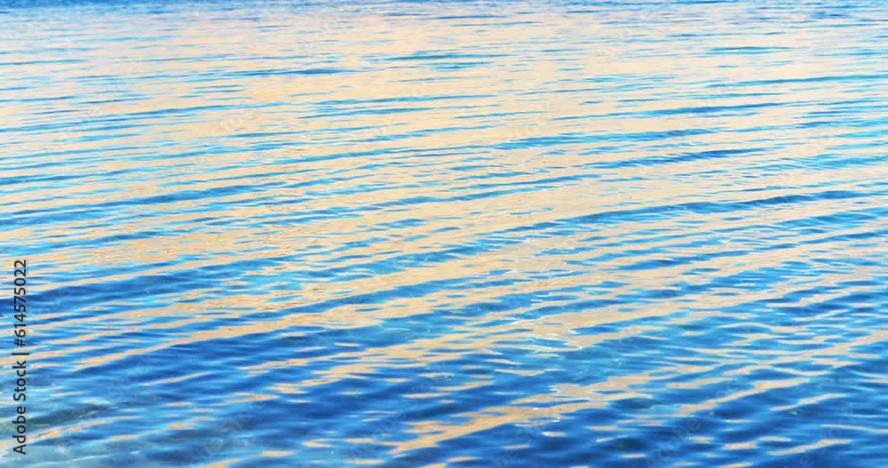 Sun light reflects on quit surface of water Sun light reflects on quit surface of water