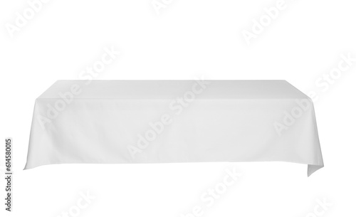 Table with white tablecloth isolated on white photo