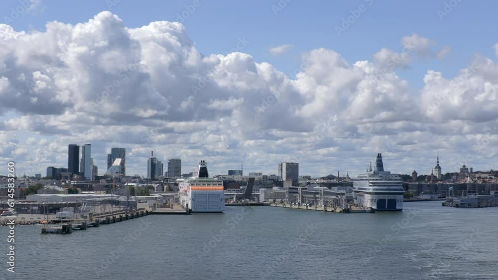 Tallinn.Estonia-July 21.2021: Idyllic shot of Tallinn viewed from the sea. Cruise ships in the harbor. Clouds in the sky on a sunny day. Awesome architecture. Panoramic. Camera slowly turning right. Tallinn.Estonia-July 21.2021: Idyllic shot of Tallinn viewed from the sea. Cruise ships in the harbor. Clouds in the sky on a sunny day. Awesome architecture. Panoramic. Camera slowly turning right.