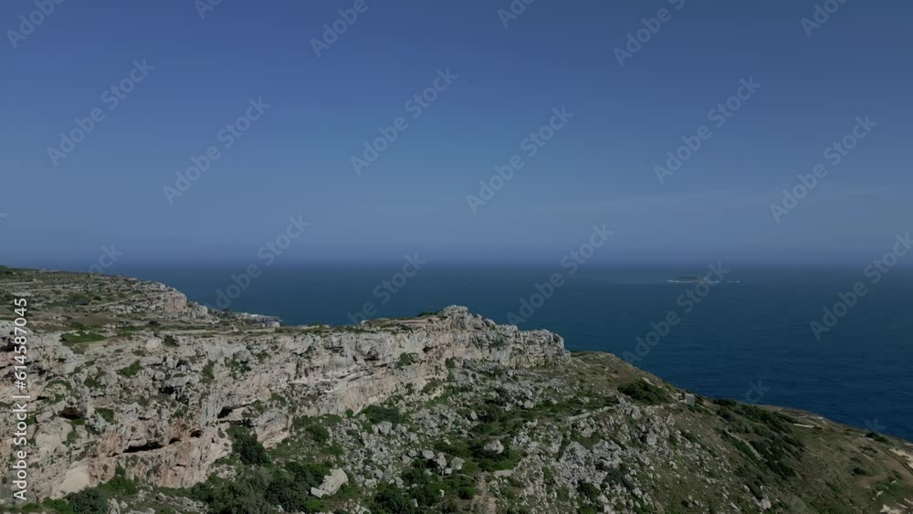 Aerial - Forward drone along ridgeline at Dingli cliff, Malta. Slow approach 