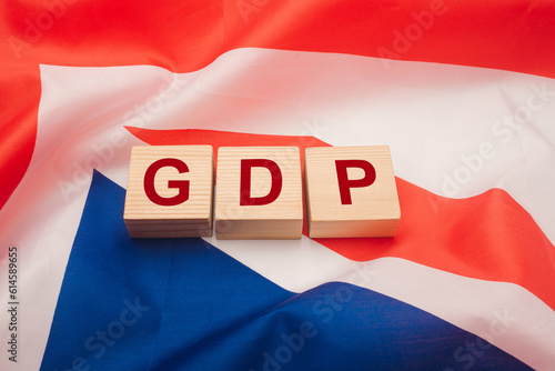 Wooden cubes with the letters GDP on the Australia flag background. photo