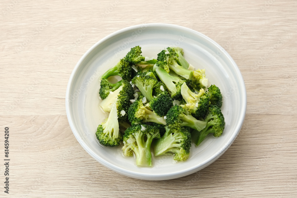 Stir fried broccoli or ca brokoli, Indonesian food, served in a bowl.
Stir fried broccoli or ca brokoli, Indonesian food, served in a bowl.