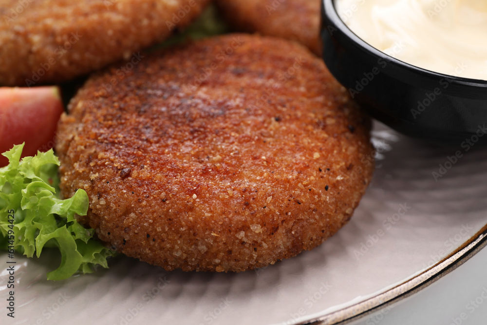 Delicious vegan cutlets on plate, closeup view