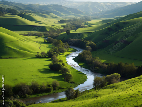 Peaceful countryside with rolling green hills and a meandering river. © Noah