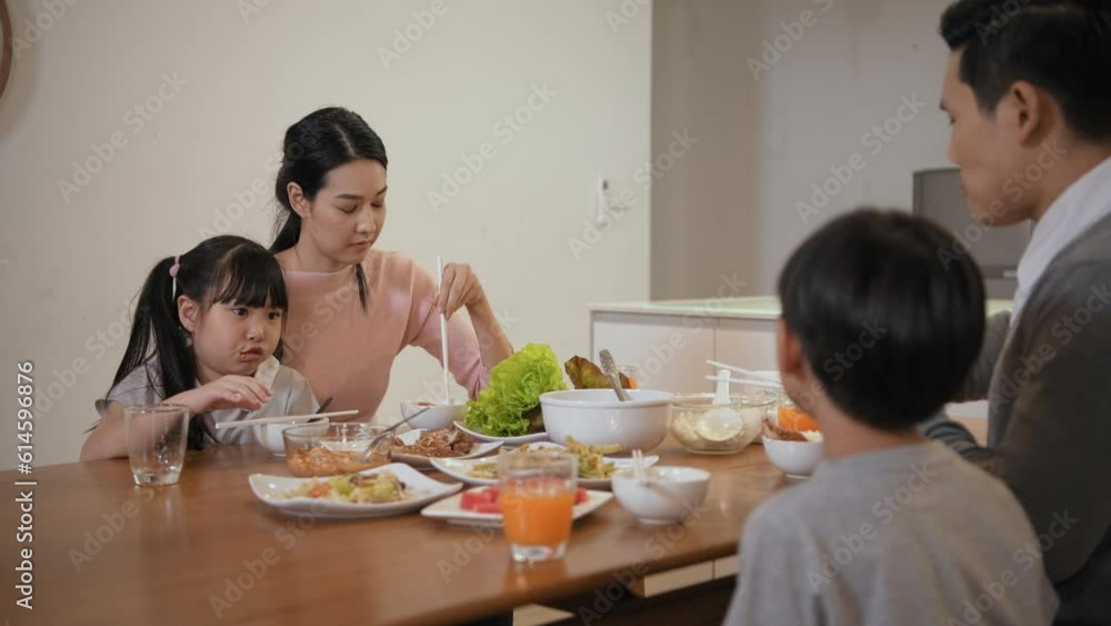 Family concept of 4k Resolution. Asian parents and children eating together in the house. Family concept of 4k Resolution. Asian parents and children eating together in the house.