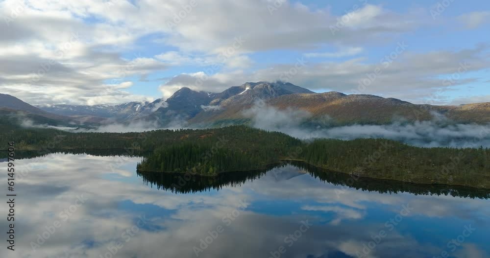 A slow drone flight over a lake in the mountain region of Norway A slow drone flight over a lake in the mountain region of Norway