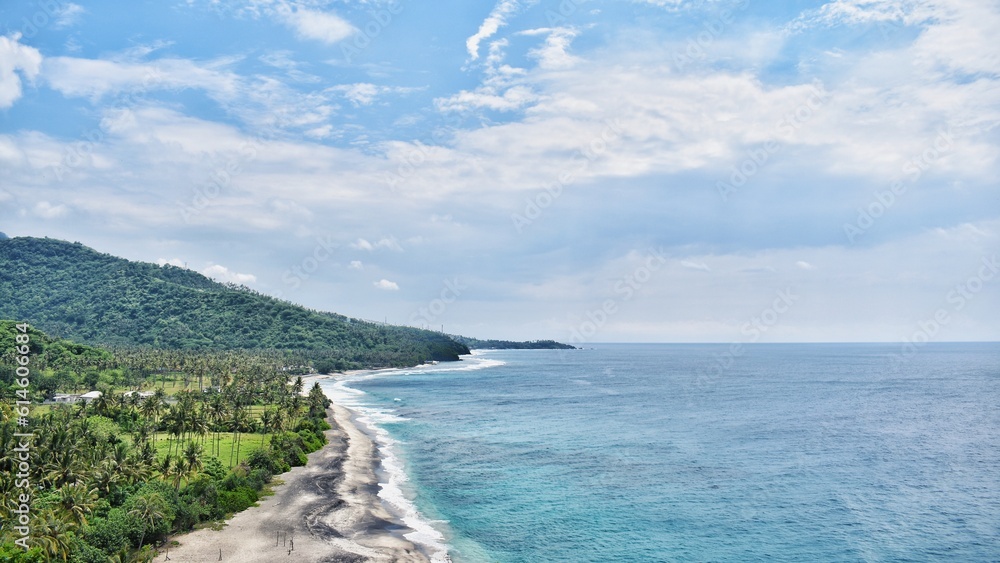 the beauty of the beach in lombok seen from the top of the hill