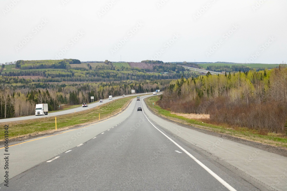 highway going through green hills