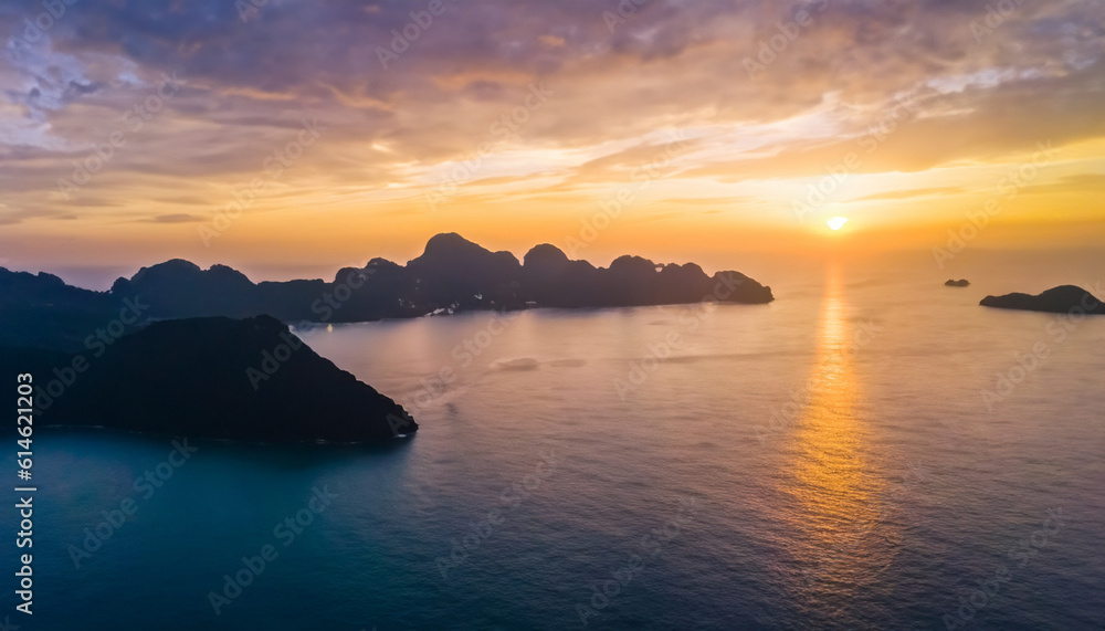 Aerial view of beautiful mountain, blue sea at colorful sunset