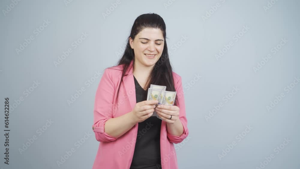 Business woman counting money looking at camera. Business woman counting money looking at camera.