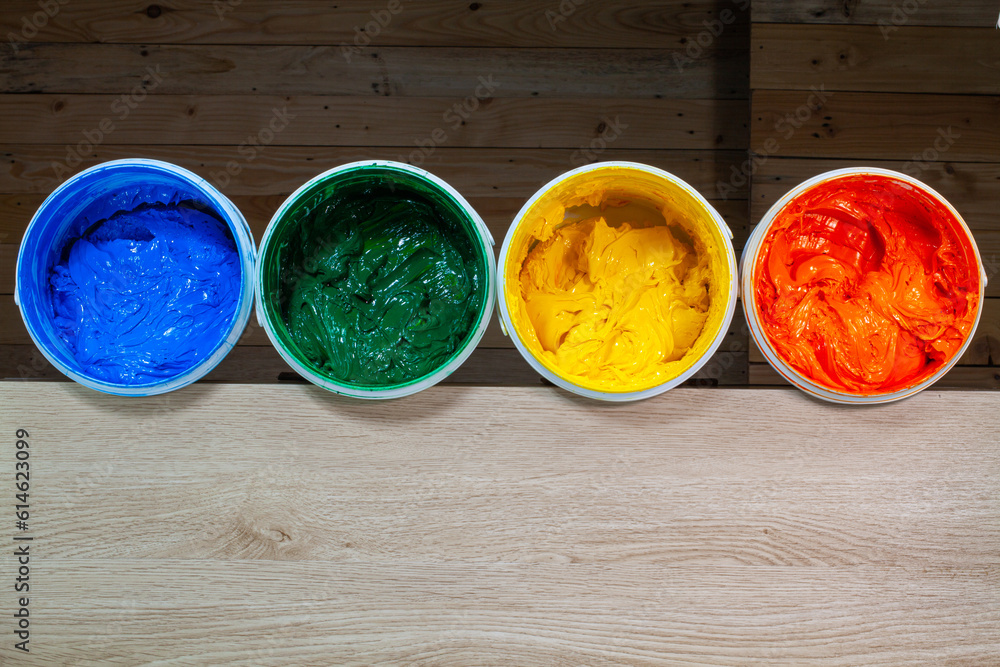 green yellow and orange paints are dripping from white barrel..high quality 4k video.colorful of paint background..plastisol ink is specially for print on tee shirts and any fabric. green yellow and orange paints are dripping from white barrel..high quality 4k video.colorful of paint background..plastisol ink is specially for print on tee shirts and any fabric.