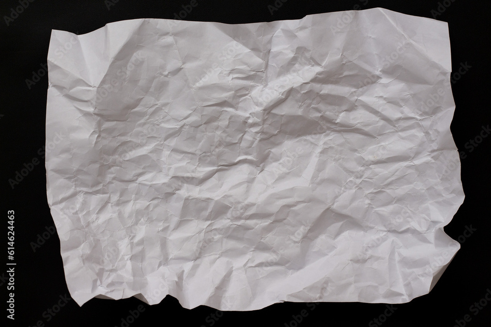 white crumpled paper texture on black background white crumpled paper texture on black background
