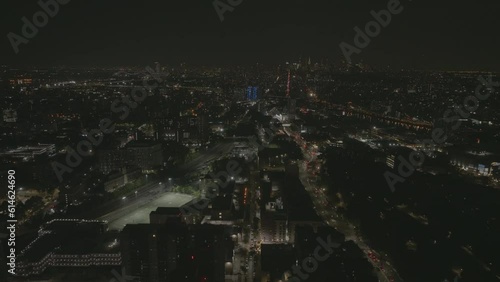 Drone shot over Bronx cityscape, toward Mott Haven, nighttime in New York, USA photo