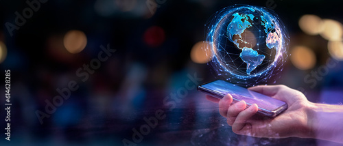 Hand holding phone, symbolizing engagement with technological advances and the power of digital connectivity. The image encapsulates the transformative impact of technology in our modern society