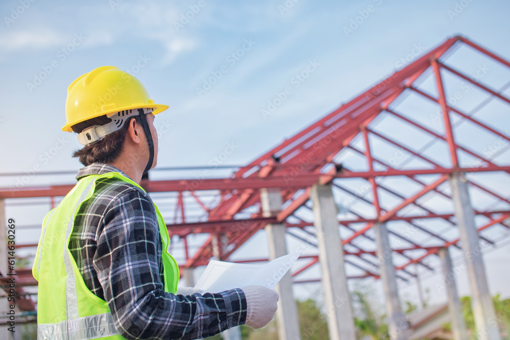 Engineer looking at unfinished roof designs consider editing Engineer looking at unfinished roof designs consider editing
