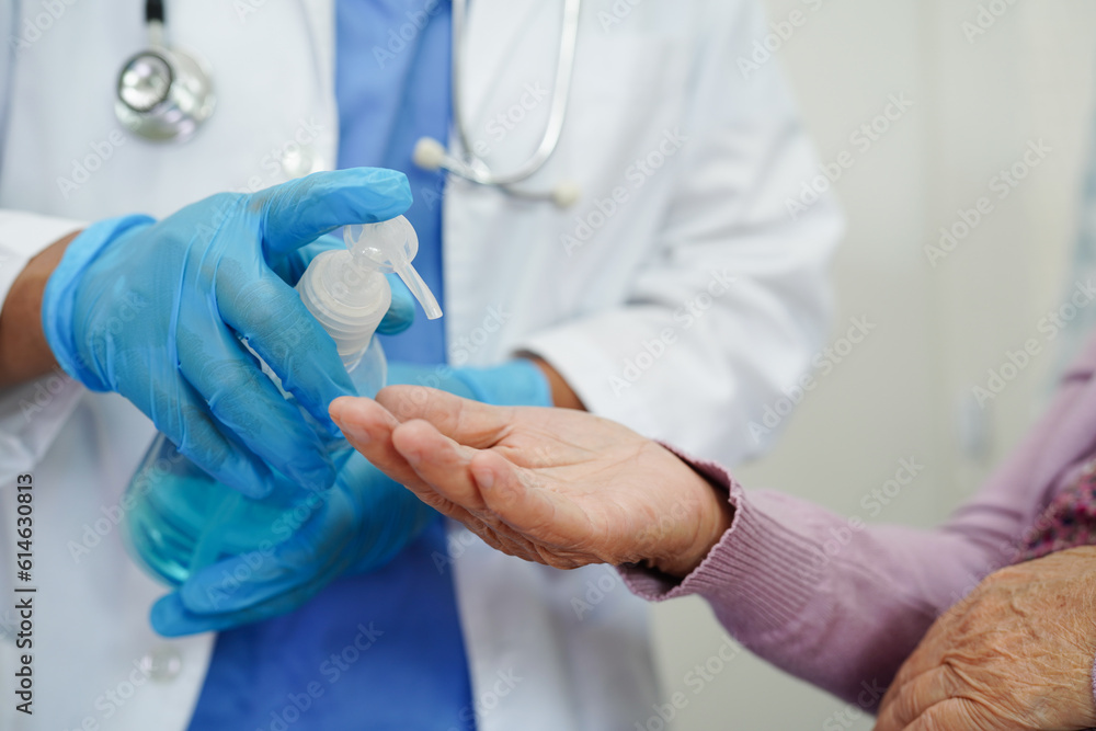 Asian senior woman press blue alcohol sanitizer gel for washing hand protect infection coronavirus. - obrazy, fototapety, plakaty 