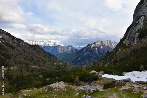 View of mountains in Julian alps in Slovenia with the peaks covered in snow from Vršič pass