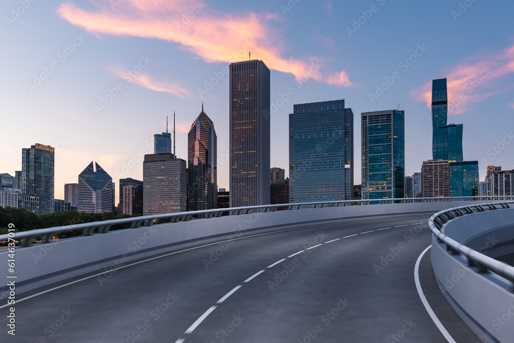 Empty urban asphalt road exterior with city buildings background. New modern highway concrete construction. Concept of way to success. Transportation logistic industry fast delivery. Chicago. USA.