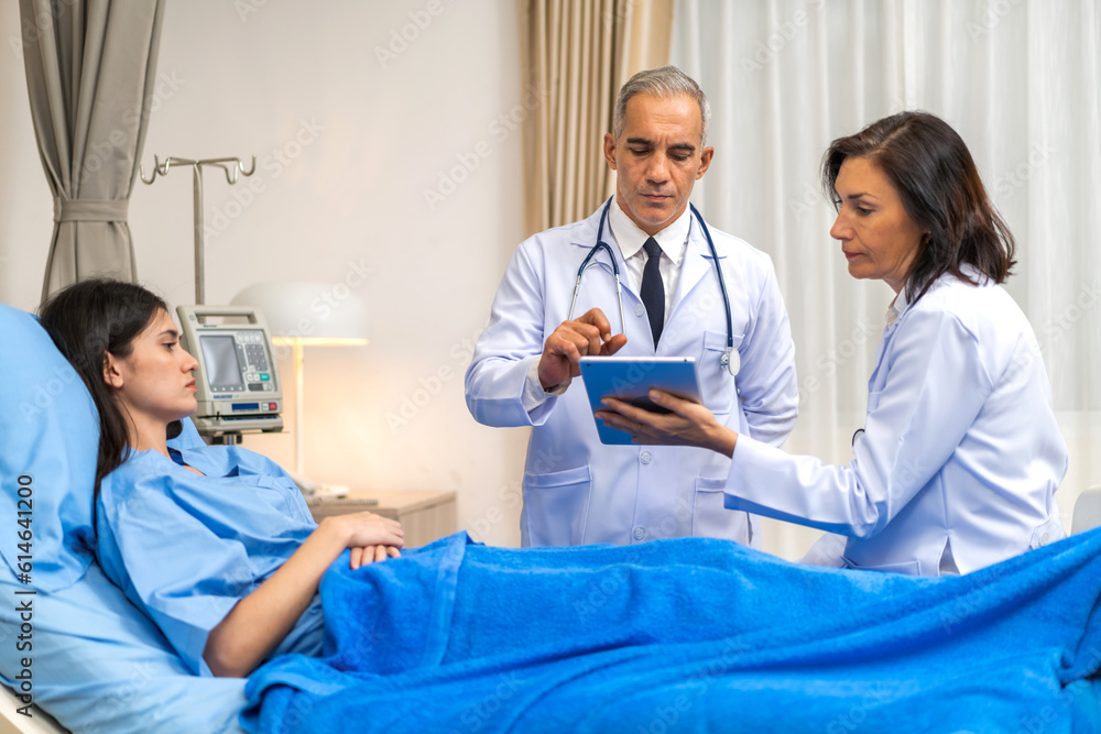 Senior man doctor wearing uniform with stethoscope help discussing and consulting talk to sick woman patient checkup information, support, care, diseases, treatment in hospital.healthcare Senior man doctor wearing uniform with stethoscope help discussing and consulting talk to sick woman patient checkup information, support, care, diseases, treatment in hospital.healthcare