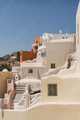 Fototapeta Naklejka Na Ścianę i Meble -  Picturesque view of Santorini, Oia, Greece. Medieval historic blue and white buildings and seaside view. Traditional European, Greek architecture. Summer holidays travel