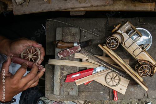 A craftsman makes automotive miniatures from bamboo in Bogor, West Java, Indonesia, June 17, 2023. Automotive made from bamboo is an environmentally friendly, and beautiful product