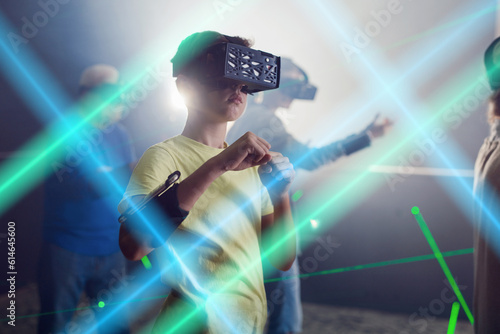 Enthusiastic grandparents with grandchildren in virtual reality glasses in quest room
