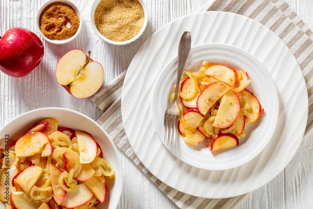 fried onion and red apple slices on white plate and in bowl on white wood table with ingredients and spices, horizontal view from above, flat lay fried onion and red apple slices on white plate and in bowl on white wood table with ingredients and spices, horizontal view from above, flat lay
