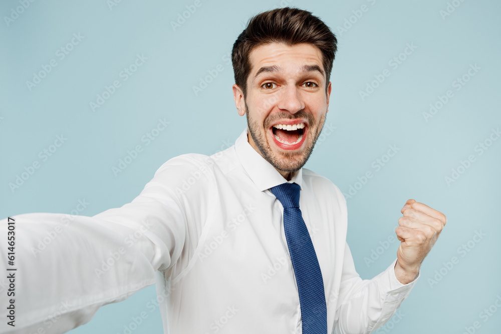 Close up young employee business man corporate lawyer wears classic formal shirt tie work in office do selfie shot pov on mobile cell phone do winner gesture isolated on plain blue background studio. Close up young employee business man corporate lawyer wears classic formal shirt tie work in office do selfie shot pov on mobile cell phone do winner gesture isolated on plain blue background studio.