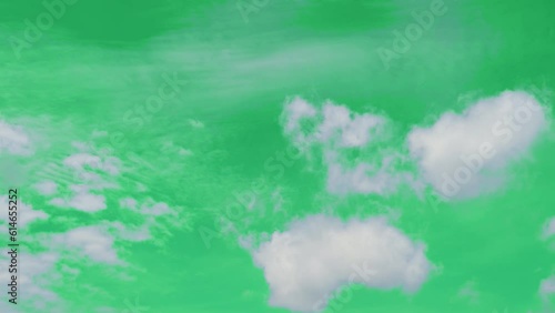 The green screen of moving white clouds with 4K resolution. Can use to change the background color.