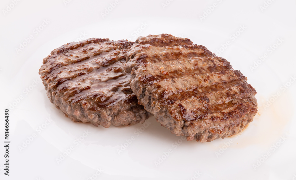 Beef cutlet grill with stripes on a gray background. grilled hamburger meat. Beef cutlet grill with stripes on a gray background. grilled hamburger meat.