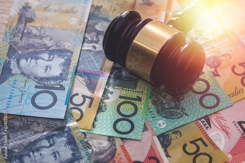 Judge's gavel on australian dollars, justice concept photo