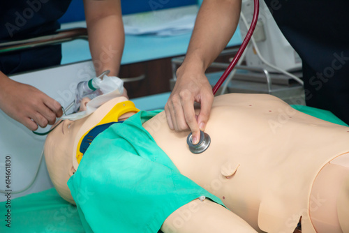 chest compression and ventilation with mask with bag on model for airway management in CPR training course at simulation room: soft focus