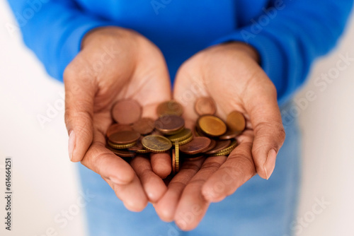 Hands of woman holding coins photo