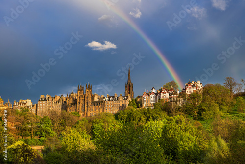 UK, Scotland, Edinburgh,Rainbow arching over old town skyline photo