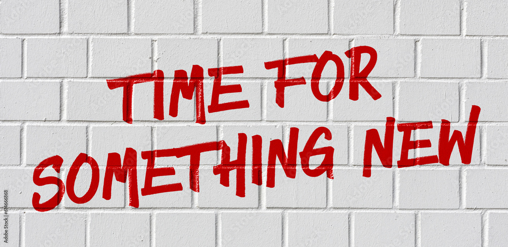 Graffiti on a brick wall - Time for something new Graffiti on a brick wall - Time for something new