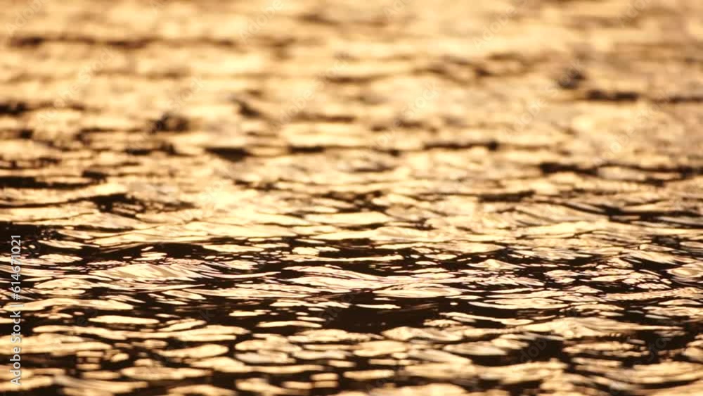 Sun reflecting on sparkling sea lake water surface, ocean at sunset, sunrise. Sunrays flickering in Ripples on water surface. Golden shimmering sea waves in sun. Slow motion. Abstract nautical nature Sun reflecting on sparkling sea lake water surface, ocean at sunset, sunrise. Sunrays flickering in Ripples on water surface. Golden shimmering sea waves in sun. Slow motion. Abstract nautical nature