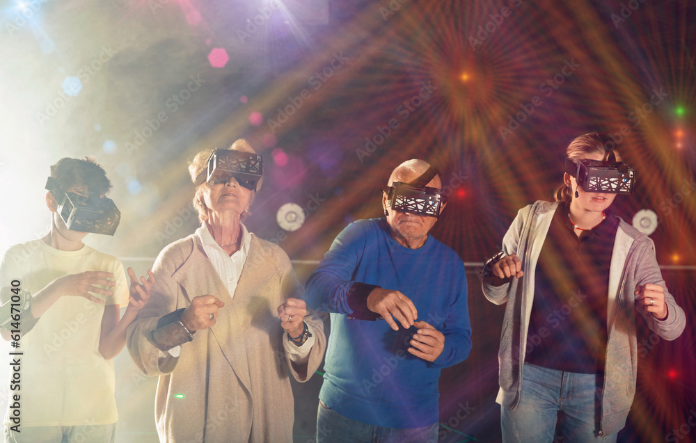 Obraz premium Rapturous grandparents with grandchildren are looking for way out of virtual escape room