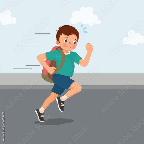 Cute little boy student with backpack running late to school