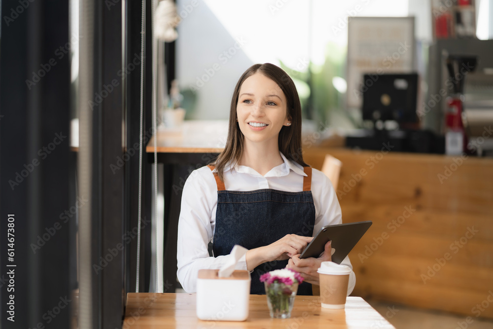 Startups Successful Entrepreneurs Small Businesses Female SME business owner sitting looking up in coffee shop restaurant portrait of successful young girl barista.